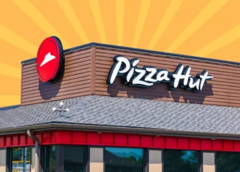 Pizza Hut restaurant exterior featuring the logo and signage on a building.