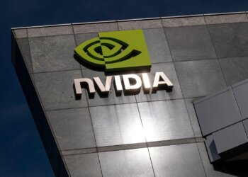 NVIDIA logo displayed on the exterior of a modern building with a reflective surface.