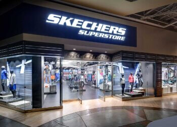 Exterior view of a Skechers superstore with large signage and display windows.