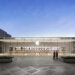 Exterior view of an Apple Store featuring a glass facade and the Apple logo.