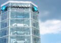 Carvana vehicle vending machine displaying multiple cars in a glass structure.
