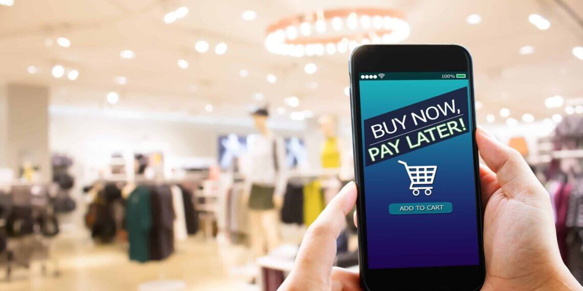 Smartphone showing a 'Buy Now, Pay Later' screen with a shopping cart icon.