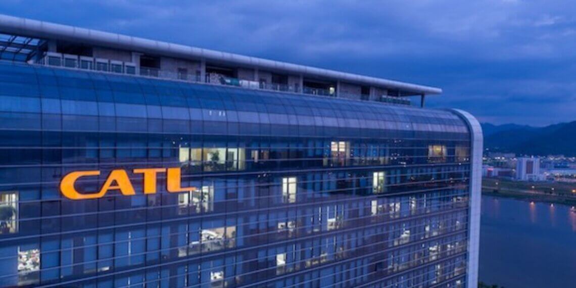 Exterior view of the CATL corporate building illuminated at dusk with the company logo visible.