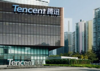 Exterior view of Tencent headquarters building with the company name displayed prominently.
