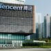 Exterior view of Tencent headquarters building with the company name displayed prominently.