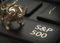 A golden bull figurine positioned on a black keyboard key labeled S&P 500.