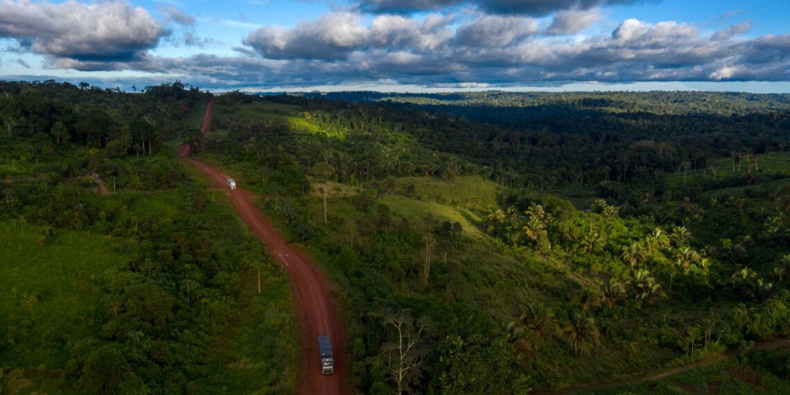 Aerial view of the Trans-Amazonian Highway surrounded by dense forest in Brazil.