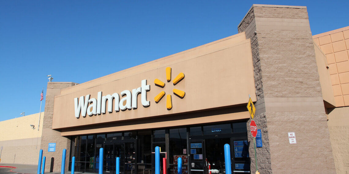 Exterior view of a Walmart store with the logo prominently displayed above the entrance.