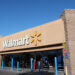 Exterior view of a Walmart store with the logo prominently displayed above the entrance.