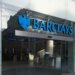 Entrance of a Barclays Bank branch featuring the logo and glass facade.