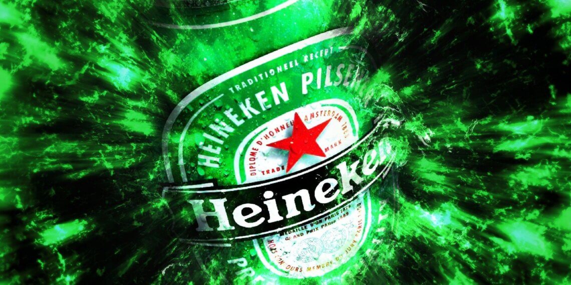 Heineken beer bottle with a green and black abstract background effect.