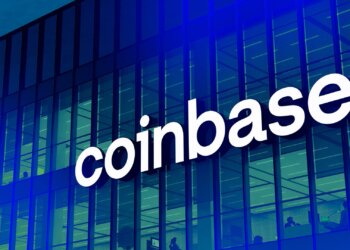 Coinbase logo displayed prominently on the exterior of a modern building.