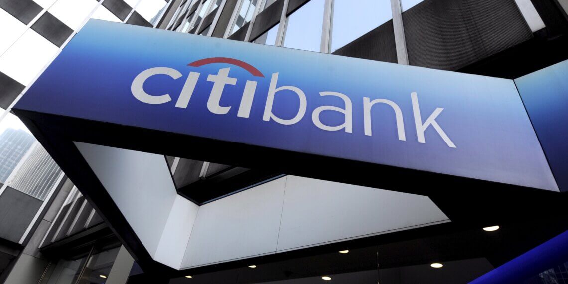 CitiBank signage displayed on the exterior of a building with a blue gradient background.