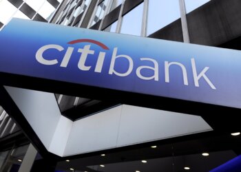 CitiBank signage displayed on the exterior of a building with a blue gradient background.