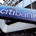 CitiBank signage displayed on the exterior of a building with a blue gradient background.