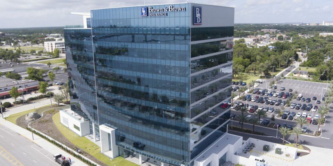 Aerial view of the Brown and Brown corporate office building with reflective glass windows.