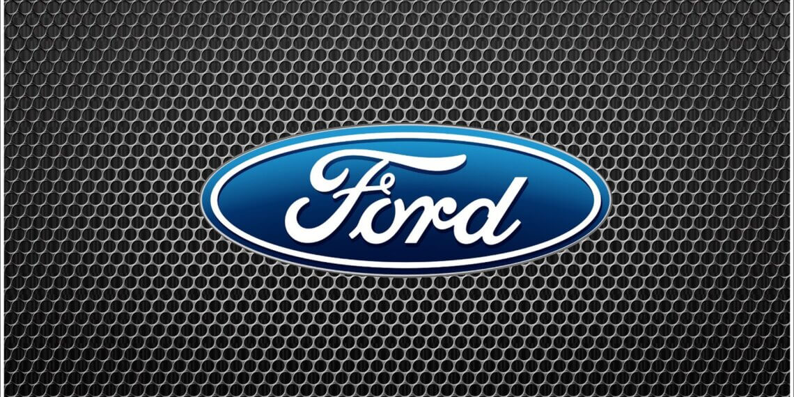 Ford logo displayed on a textured black background with a honeycomb pattern.