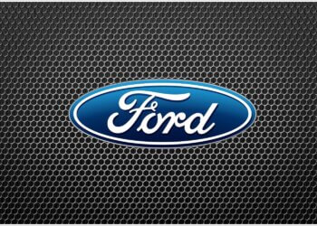 Ford logo displayed on a textured black background with a honeycomb pattern.