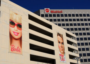 Billboards featuring Barbie and Ken displayed on the exterior of the Mattel building.