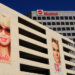 Billboards featuring Barbie and Ken displayed on the exterior of the Mattel building.
