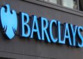 Blue Barclays logo displayed on a building exterior with a shield emblem.