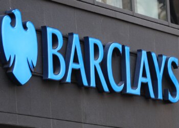 Blue Barclays logo displayed on a building exterior with a shield emblem.