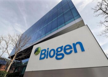 Exterior view of the Biogen corporate building with a prominent sign displaying the company name.