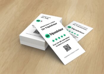 Stack of cards with a QR code and instructions to leave a review on Tripadvisor.