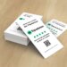 Stack of cards with a QR code and instructions to leave a review on Tripadvisor.