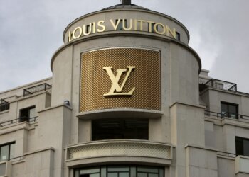 Exterior view of a Louis Vuitton store featuring the brand's logo and signage.