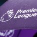 Purple umbrella featuring the Premier League logo with a lion and text.