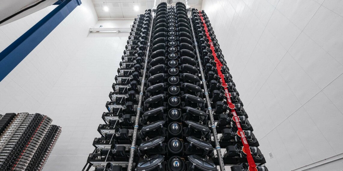 A vertical arrangement of Starlink V2 Mini satellites in a storage facility.