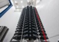 A vertical arrangement of Starlink V2 Mini satellites in a storage facility.