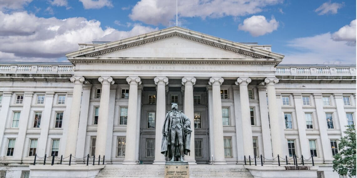 U.S. Treasury Department building featuring a statue of Robert Morris in front.