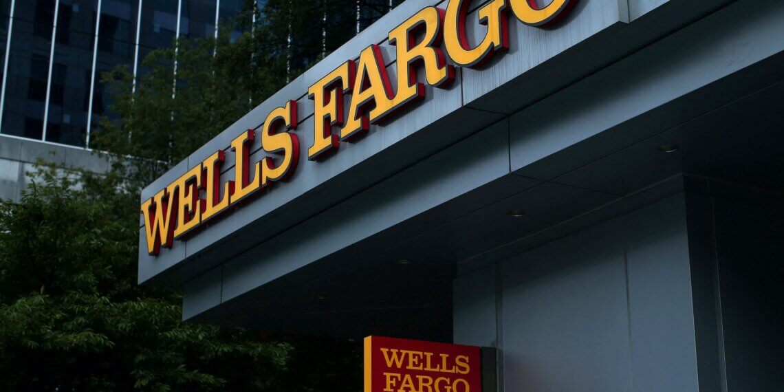 Wells Fargo signage displayed on the exterior of a building with a red and yellow color scheme.