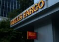 Wells Fargo signage displayed on the exterior of a building with a red and yellow color scheme.