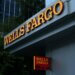 Wells Fargo signage displayed on the exterior of a building with a red and yellow color scheme.