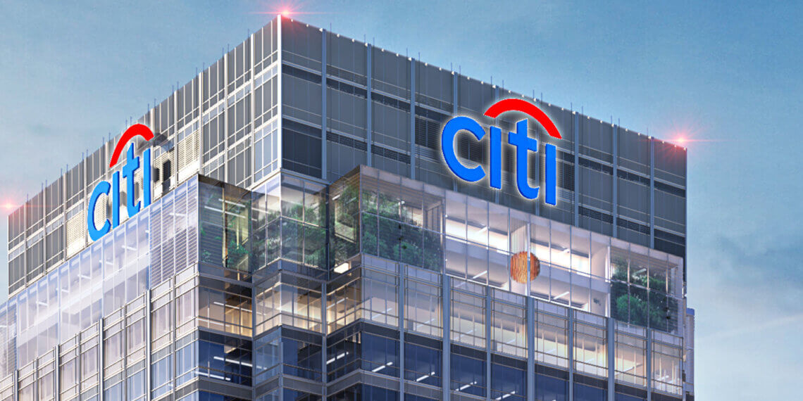 Citi Bank building with prominent logo displayed on the upper facade against a clear sky.