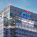 Citi Bank building with prominent logo displayed on the upper facade against a clear sky.