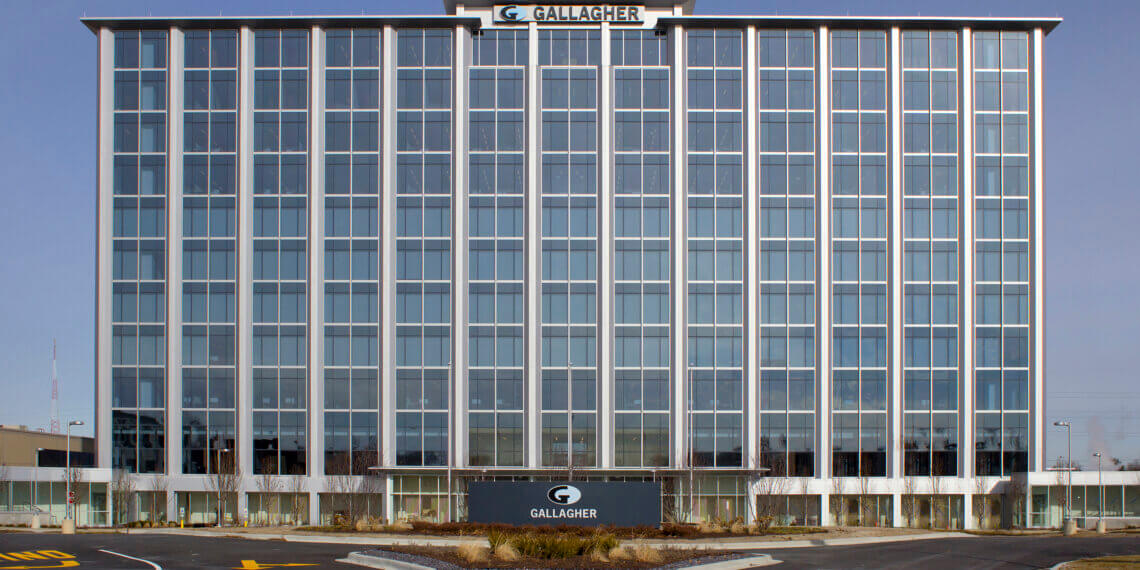 Exterior view of the Gallagher corporate office building with large glass windows.