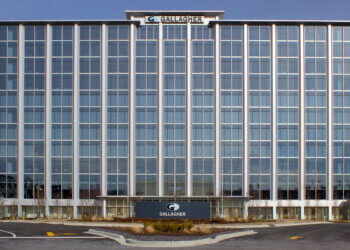 Exterior view of the Gallagher corporate office building with large glass windows.