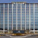 Exterior view of the Gallagher corporate office building with large glass windows.