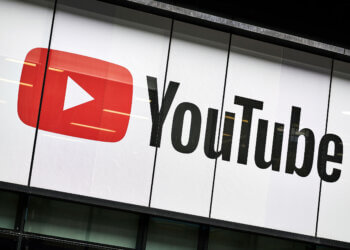 YouTube logo displayed prominently on a building's exterior with a red play button.