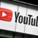 YouTube logo displayed prominently on a building's exterior with a red play button.