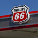 Phillips 66 logo displayed on the roof of a gas station under a clear blue sky.