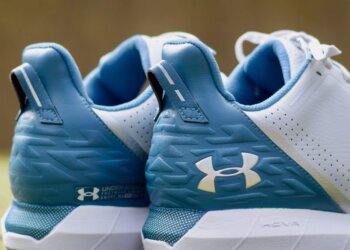 Close-up view of the back of Under Armour HOVR Drive spikeless golf shoes in blue and white.