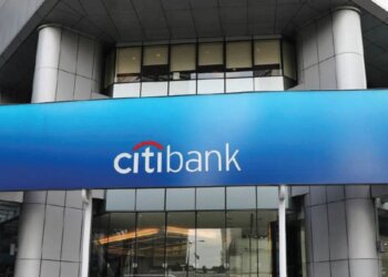 CitiBank logo displayed on a blue sign above the entrance of a building.