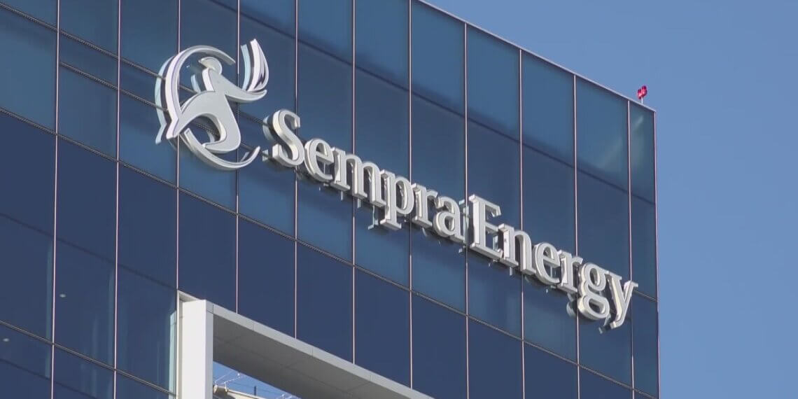 Sempra Energy logo displayed on the exterior of a modern glass building.
