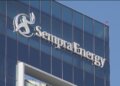 Sempra Energy logo displayed on the exterior of a modern glass building.